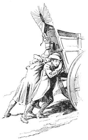 boys pushing the wagon up the moutain road