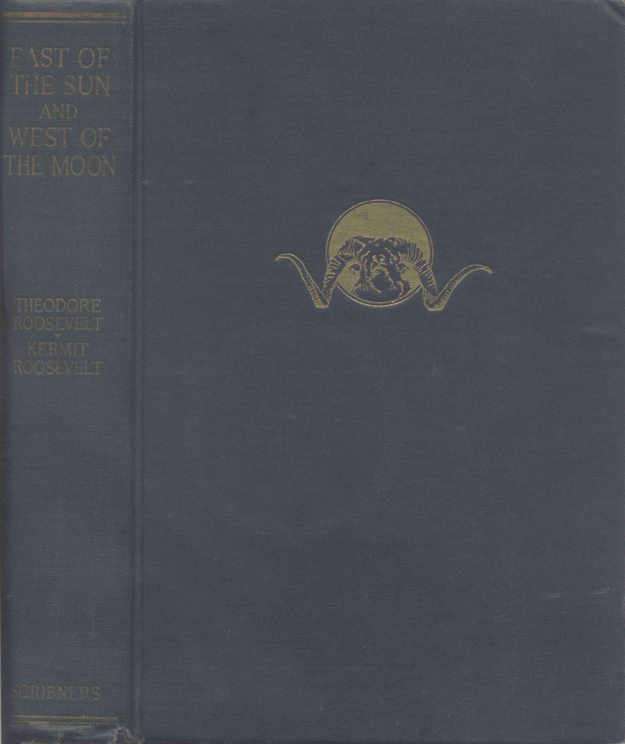 A golden bull in front of a sun on a blue background.